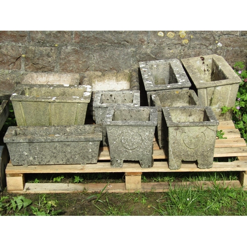 712 - A set of four weathered cast composition stone square tapered planters with repeating relief detail,... 