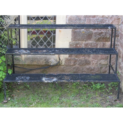 718 - A good quality heavy gauge plant stand on three stepped tiers 153 cm long x 70 cm wide x 92 cm high