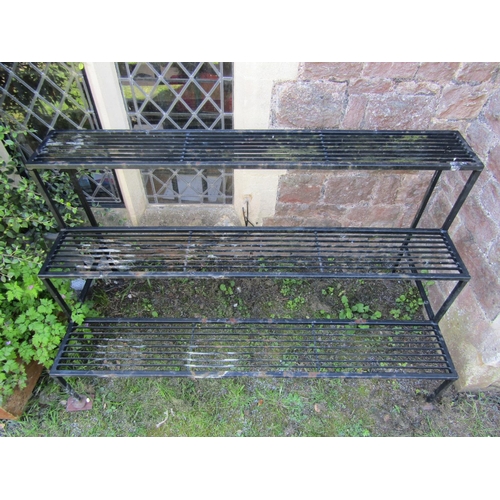 718 - A good quality heavy gauge plant stand on three stepped tiers 153 cm long x 70 cm wide x 92 cm high