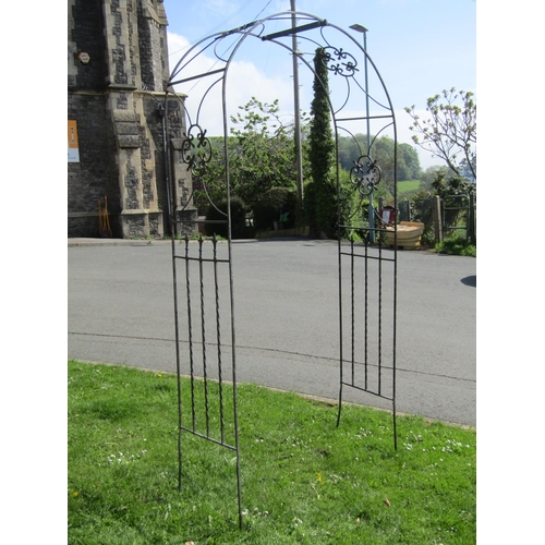 722 - A weathered galvanised steel rose arch/arbour with arrow head and twisted bar detail, 126 cm wide x ... 