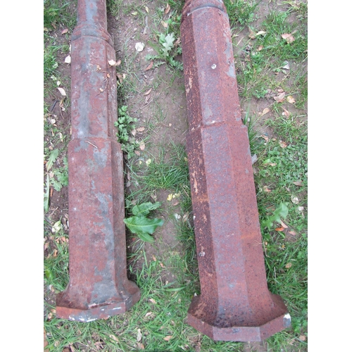 704 - A set of four weathered heavy gauge cast iron architectural columns with octagonal caps and bases, 2... 