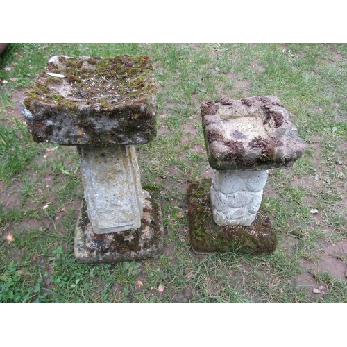 706 - A small weathered three sectional cast composition stone bird bath with square top, pedestal and ste... 