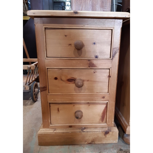 3099A - A small stripped pine chest of three drawers