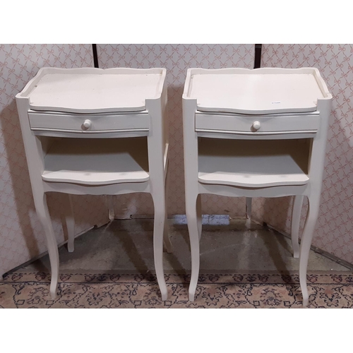 3110 - A pair of contemporary bedside tables with shallow frieze drawers on shaped supports with painted fi... 