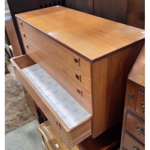 3114 - A mid century teakwood chest of four long graduated drawers by Alfred Cox 108 cm wide