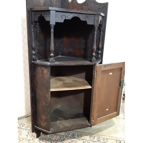 3119 - 19th century poker work hanging corner cupboard with floral detail, partially enclosed by a panelled... 