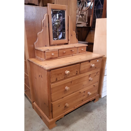 3121 - A pine dressing chest of two long and two short drawers with raised mirror back