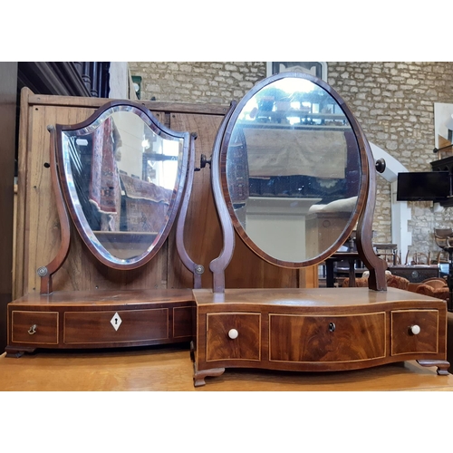 3129 - Two Georgian mahogany toilet mirrors one with shield shaped mirror plate on bow fronted base, the ot... 