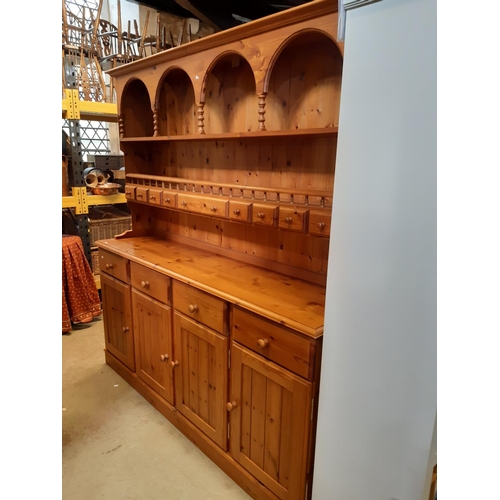 3136 - A Cotswold collection pine dresser of traditional form enclosed by four long cupboards and four draw... 