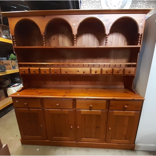 3136 - A Cotswold collection pine dresser of traditional form enclosed by four long cupboards and four draw... 