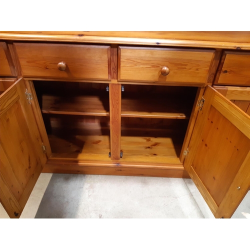 3136 - A Cotswold collection pine dresser of traditional form enclosed by four long cupboards and four draw... 