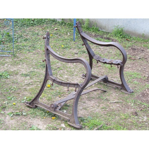 92A - A pair of heavy gauge Victorian cast iron bench ends stamped Spencer Heath & George, Ponders End, Mi... 