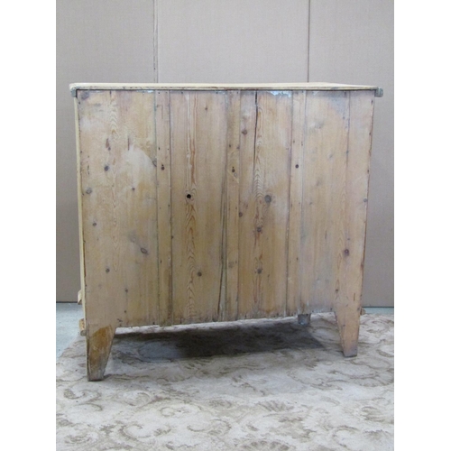 3126 - A stripped pine chest of two long and two short drawers on turned supports