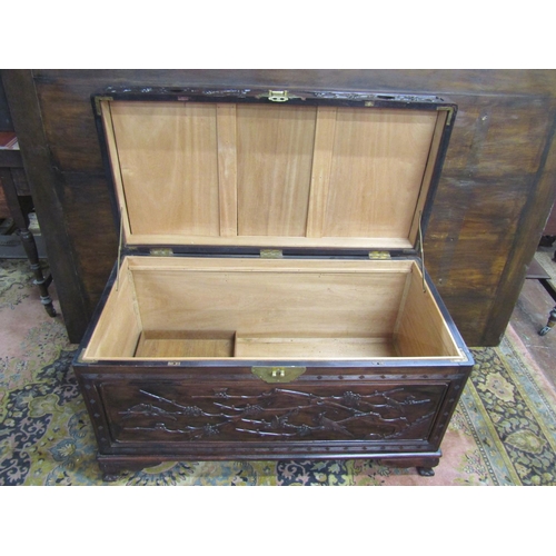 3521 - A good quality Chinese camphor lined hard wood coffer with finish and hawthorn bough repeating detai... 