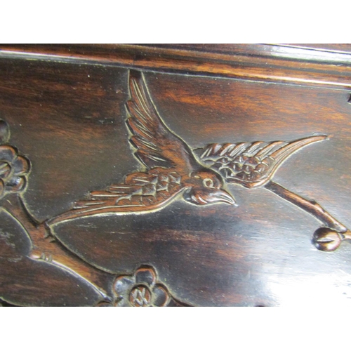 3521 - A good quality Chinese camphor lined hard wood coffer with finish and hawthorn bough repeating detai... 