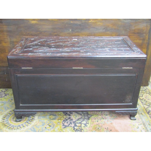 3521 - A good quality Chinese camphor lined hard wood coffer with finish and hawthorn bough repeating detai... 