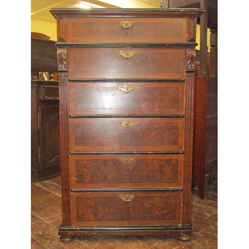 3535 - A continental pine tower of six drawers with original simulated mahogany and walnut painted detail, ... 