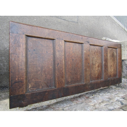 3536 - A simple honest early 18th century oak coffer, the front elevation enclosed by two panels beneath a ... 