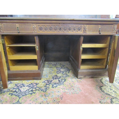 3537 - A late 19th century pale mahogany pedestal writing desk, each pedestal fitted with three deep drawer... 