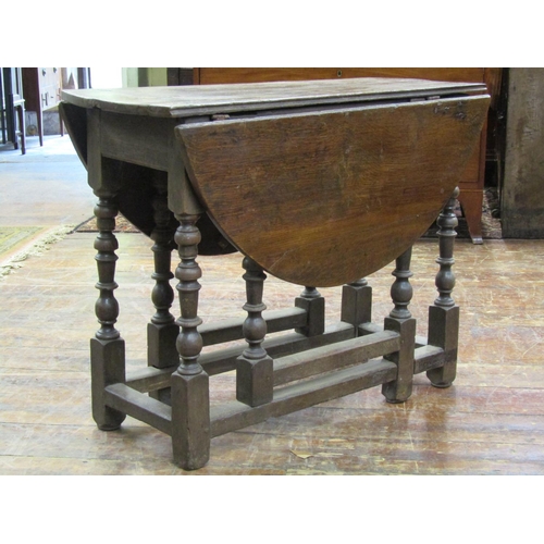 3544 - 18th century oak cottage dining table on eight turned supports, with frieze drawer, 90cm long