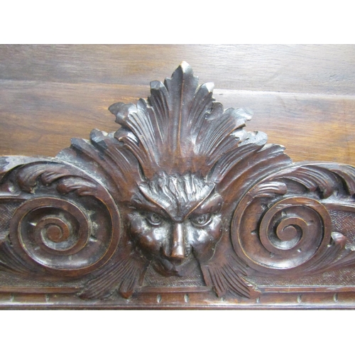 3547 - A Victorian oak hall table with frieze drawer on square cut supports, with green man, lion mask, and... 