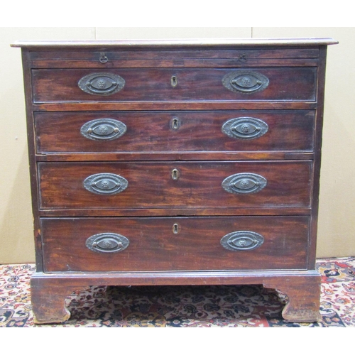 3559 - A small Georgian mahogany and oak lined chest of four long drawers with brush slide, on brackets sup... 