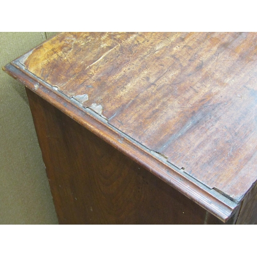 3559 - A small Georgian mahogany and oak lined chest of four long drawers with brush slide, on brackets sup... 