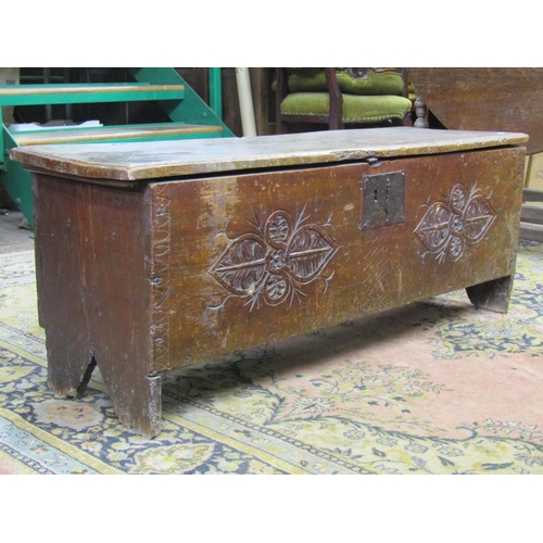 3561 - 18th century elm six plank coffer with simple geometric carved detail and steel lock plate, 110cm wi... 