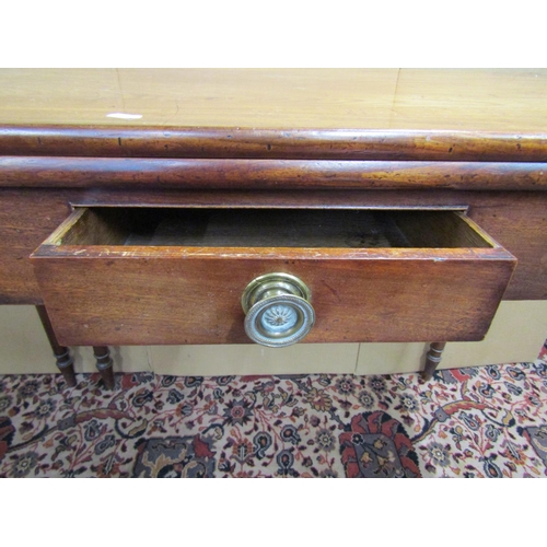 3567 - An early 19th century mahogany cottage fold over top dining table with simple frieze drawer on four ... 