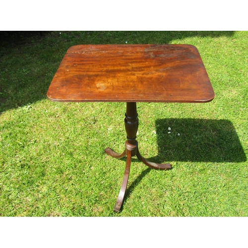 3570 - A Georgian mahogany occasional table the rectangular top raised on a vase shaped pillar and tripod, ... 