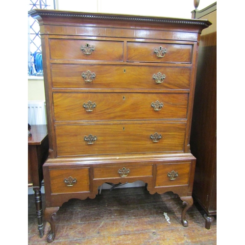 3581 - A Georgian mahogany chest on stand, the chest of three long and two short graduated drawers beneath ... 