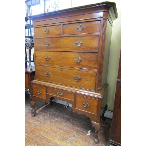 3581 - A Georgian mahogany chest on stand, the chest of three long and two short graduated drawers beneath ... 