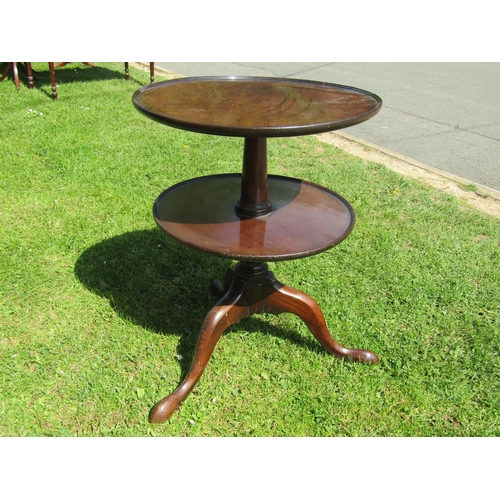 3583 - A Georgian mahogany two tier waiter on turned pillar and tripod base