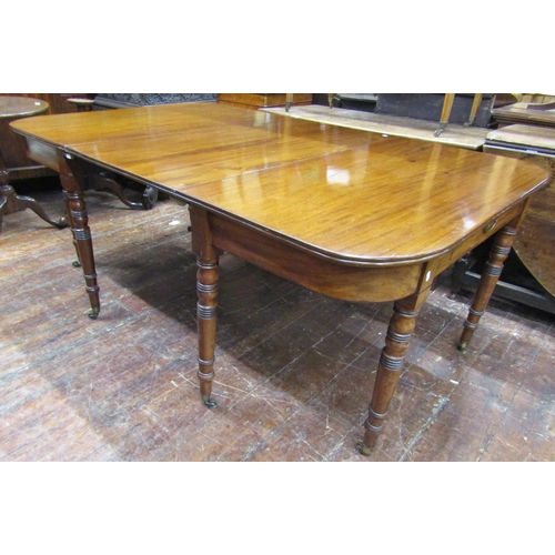 3584 - A Georgian mahogany D end dining table with central leaf raised on eight turned supports (can be use... 