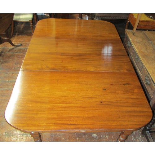 3584 - A Georgian mahogany D end dining table with central leaf raised on eight turned supports (can be use... 