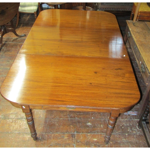 3584 - A Georgian mahogany D end dining table with central leaf raised on eight turned supports (can be use... 