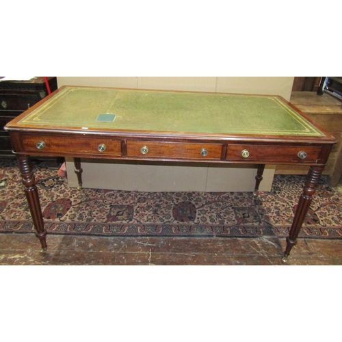 3590 - A good reproduction mahogany library/writing table in the Gillows manner fitted with three frieze dr... 