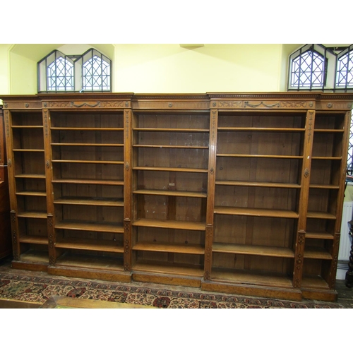 3592 - A substantial five sectional oak library bookcase of full height, five bays enclosing adjustable she... 