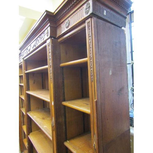 3592 - A substantial five sectional oak library bookcase of full height, five bays enclosing adjustable she... 