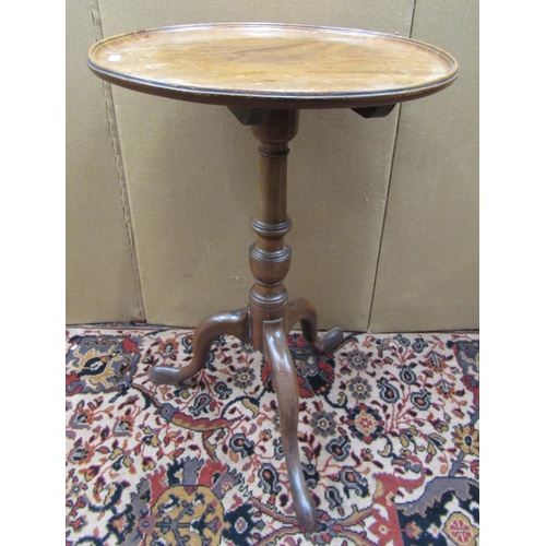 3600 - A Georgian mahogany occasional table, the dished top raised on a turned pillar and tripod base, 45 c... 