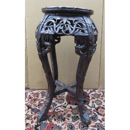 3608 - A Chinese hardwood jardiniere stand with carved and pierced frame and inset circular marble top, 60 ... 