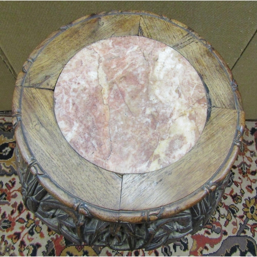 3608 - A Chinese hardwood jardiniere stand with carved and pierced frame and inset circular marble top, 60 ... 