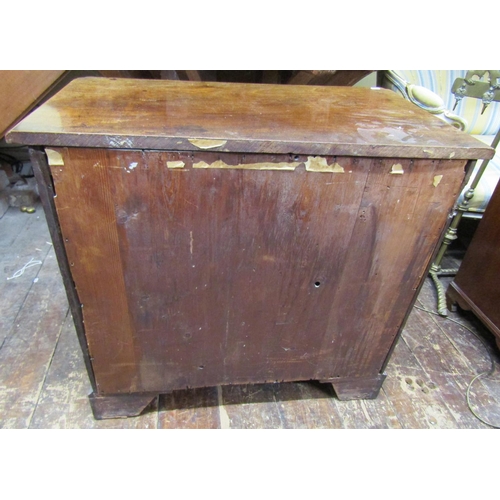 3623 - A small Georgian mahogany chest of four long graduated drawers with brush slide on bracket supports,... 