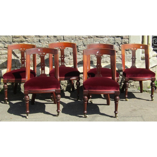 3634 - A set of six Victorian mahogany dining chairs with carved and pierced splats, upholstered seats, flu... 