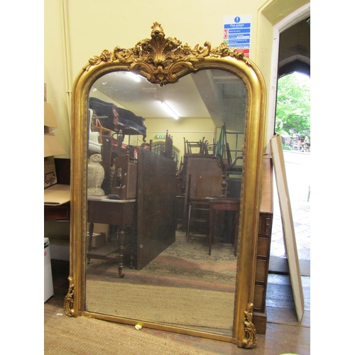 3527 - A large 19th century gilded overmantle mirror, the moulded framework surmounted by floral sprays, 18... 