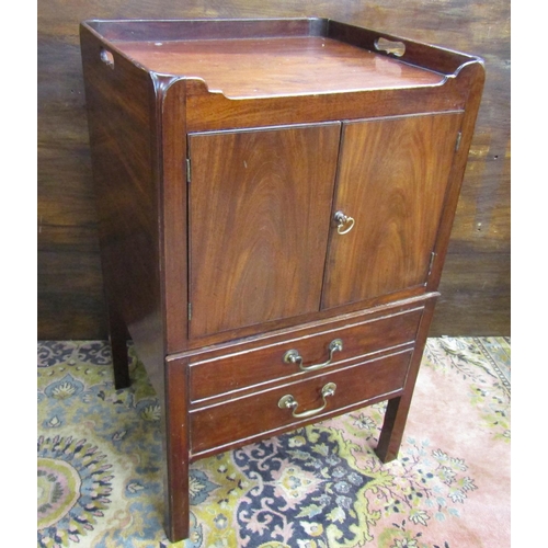 3546 - A Georgian mahogany tray top commode, the front elevation enclosed by a pair of panelled doors over ... 