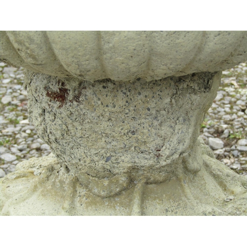 175A - A pair of large weathered cast composition stone campana shape garden urns with fixed ring and loop ... 