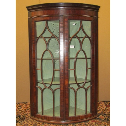 3523 - A good quality regency mahogany bowfronted hanging corner cupboard, unusually with glazed doors, wit... 