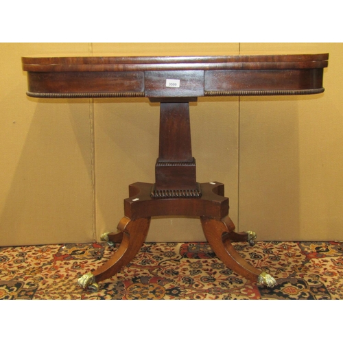 3599 - A Regency mahogany D end fold over top card table on square taper pillar, platform and four sabre su... 