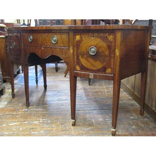 3602 - A Georgian mahogany bow fronted sideboard, the central drawer flanked by a cellarette and cupboard r... 